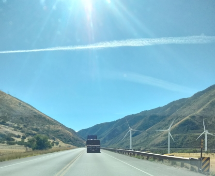 road with hills and wind turbines